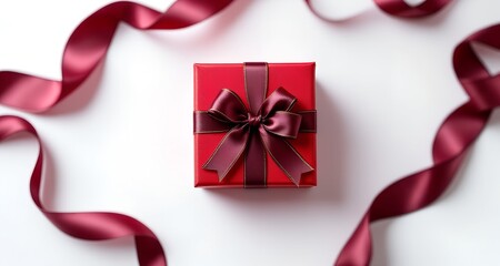 Luxury red gift box with beautiful ribbon on white background