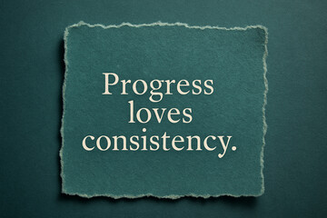 Torn paper on teal with message — progress loves consistency — motivational business banner