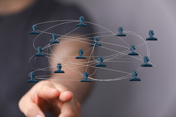 Digitally connected human figures network representing global communication and teamwork. Conceptual image about network and communication.