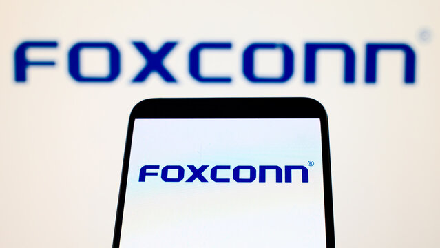 London, UK, 06.11.2025: Foxconn logo on smartphone screen with defocused background 