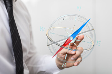 Close-up of a businessman's hand holding a modern, digital compass, symbolizing direction, strategy, and business planning. Perfect for illustra