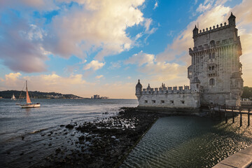 Belem Tower or Tower of St Vincent - famous tourist landmark of Lisboa and tourism attraction - on the bank of the Tagus River Tejo on sunset. Lisbon, Portugal
