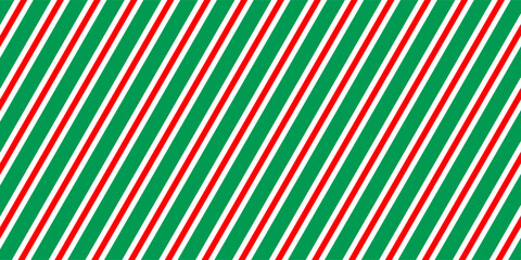 Christmas seamless pattern. Red and green diagonal stripes background. Candy cane repeating decoration wallpaper. Winter holiday lines backdrop. vector