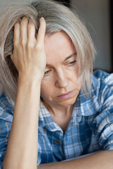 Sad, depressed and upset woman at home