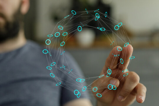 Close-up of a hand touching a digital network. Concept of technology, connectivity, innovation, and futuristic concepts.