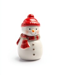 A ceramic snowman figurine wearing a red hat and scarf. The snowman has a cheerful expression with a small orange nose and button details.
