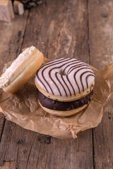 An assortment of donuts on a wooden background