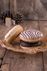 An assortment of donuts on a wooden background