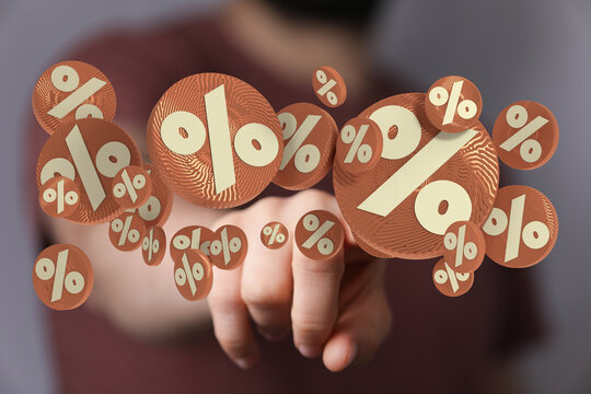 Hand reaching out to touch floating percentage signs, perfect for representing discounts, sales, and financial concepts. Use for advertising dea