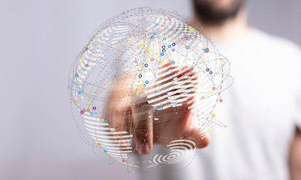 Abstract globe connected with lines in human hand, symbolizes global network, communication, and business.