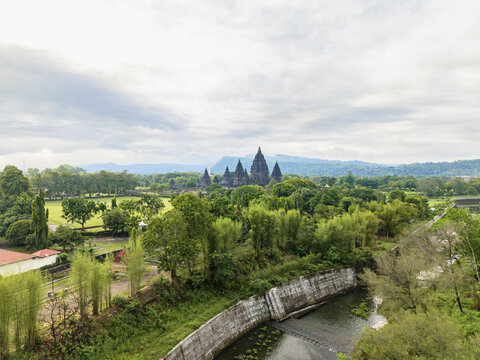 Aerial view of the majestic Prambanan Temple silhouetted against the horizon, a timeless monument amidst a verdant landscape, Yogyakarta, Daerah Istimewa Yogyakarta, Indonesia.