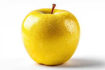 Fresh and juicy golden apple glistens with droplets of water on a stark white background.