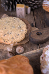 Various types of desserts and pastries on an old wooden background
