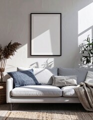 Sunlit modern living room with a blank vertical poster frame mockup 1.