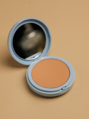 Compact pressed powder with mirror in blue container