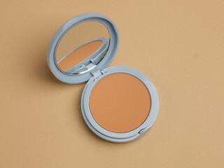 Compact pressed powder with mirror in blue container