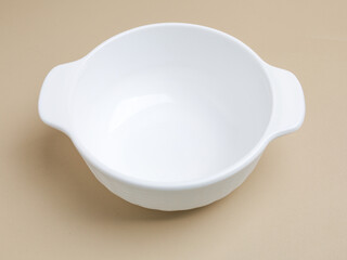 Ceramic bowl or container on beige background