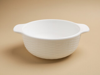 Ceramic bowl or container on beige background