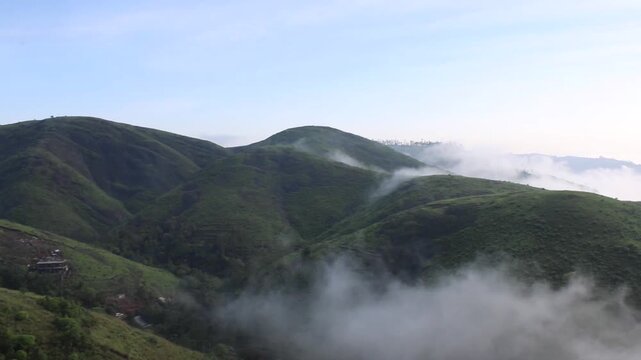mountain landscape with fog panorama of the mountains Beautiful view of Parunthumpara mountains Idukki, Kerala, India
