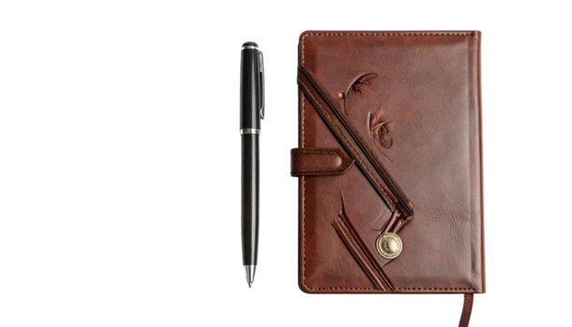 Elegant black writing instrument rests beside a detailed brown leather bound journal against a dark background