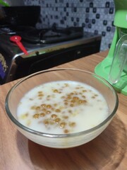 Pearl porridge is served in the form of sago grains in sweet coconut milk sauce.