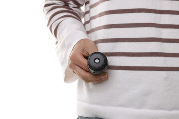 Young woman with hidden spy camera on white background, closeup