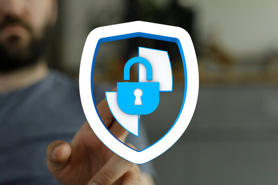 Concept of data security, cyber protection and internet safety with a shield and padlock symbol in the hand. Digital information prot