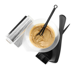 Hair dye in bowl and hairdresser's tools isolated on white, top view