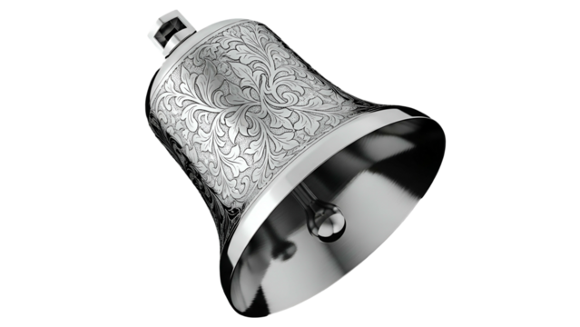 Ornate silver metal bell displays intricate scrollwork engraving against a dark background