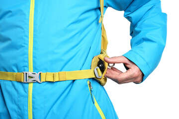 Tourist with hidden spy camera and backpack on white background, closeup