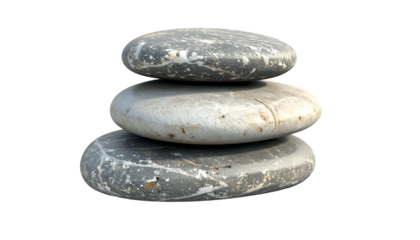 Stack of three smooth, rounded grey stones balanced vertically against a solid black background