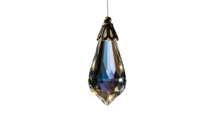 Faceted teardrop shaped glass ornament hangs suspended against a deep black background.