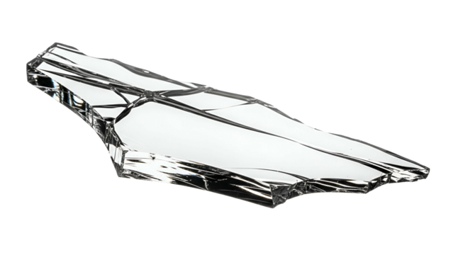 Irregularly shaped shard of clear material reflects light against a dark background