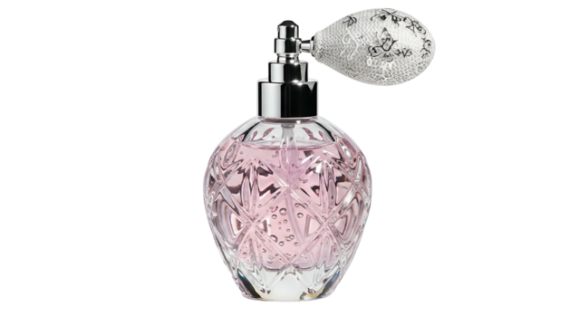 Ornate vintage style glass perfume atomizer rests against a solid black background