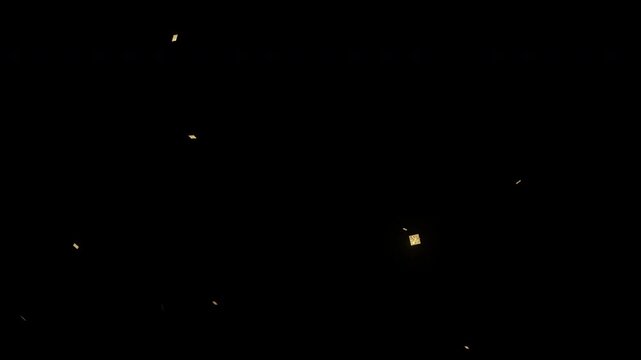 Double pop confetti square falling golden glittery pieces create a dazzling contrast on transparent background. Sparkly celebration concept suitable for party invitations or festive designs.