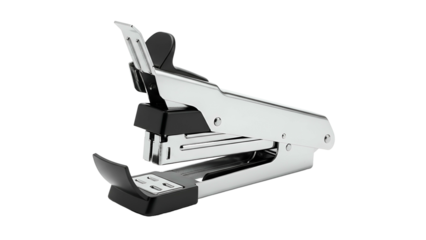 Polished metallic stapler rests against a solid black background in a close up  shot
