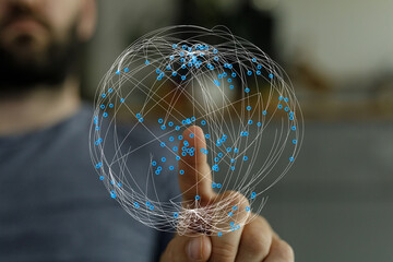 Close-up of a person's finger touching a digital globe illustration. Concept of global network, connection, communication, and techno