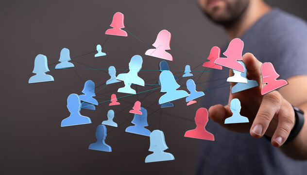 Abstract concept of online network, connection, communication and social media with person's hand interacting with digital icons of people.