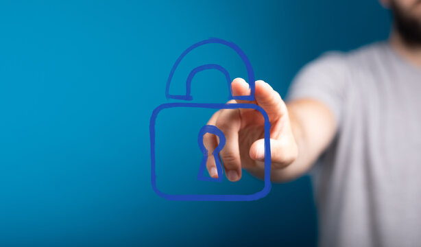 A hand touches a glowing virtual unlocked padlock, symbolizing cybersecurity, data privacy, access, and secure online technology solutions and f