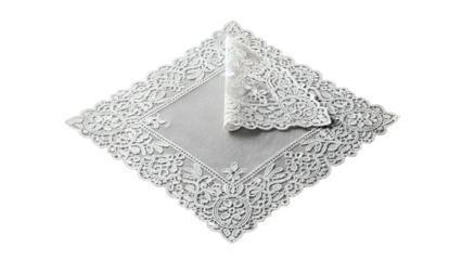 Delicate white lace fabric square is positioned diagonally against a solid black background.