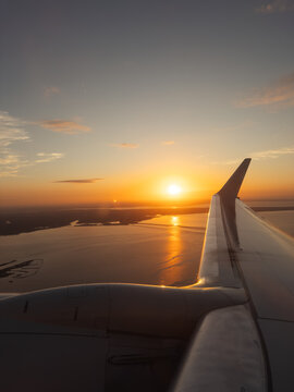 Sunrise sky over airplane wing vacation travel
