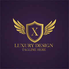 Elegant golden logo design with letter x on shield and wings for luxury brand identity concept