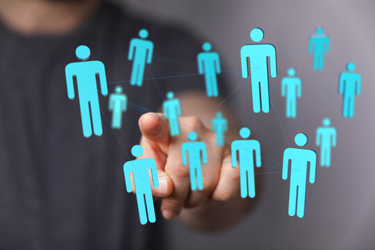 Hand pointing at a digital social network interface. Network and connection concept, teamwork and relationship communication.