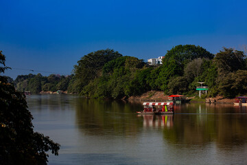 Non motorized ferry, called planchon, used by residents to cross the Sinú River from one bank to the other in the city of Montería, Colombia.