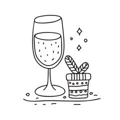 New Year toast glass displayed next to a small decorative item