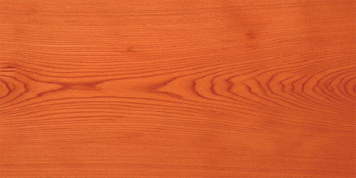 Close-up of orange wood grain texture showing natural patterns ideal for backgrounds and surface designs