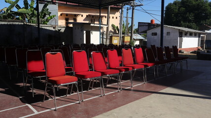 red chairs arranged neatly in the office yard