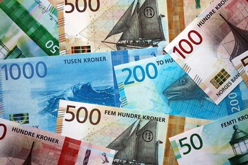 Norwegian Krone currency money bills. NOK currency banknotes in bunch with different denomination close up