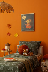 Close-up of a child’s bed with forest-themed decor and autumn accents. Soft lighting and earthy tones create a calm, comforting atmosphere.