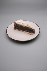poppy seed cake topped with powder sugar on a plate